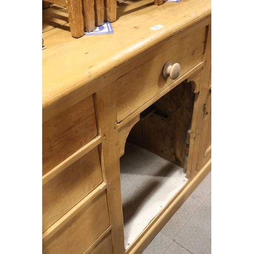 593 - A waxed pine dresser base, fitted three drawers, 