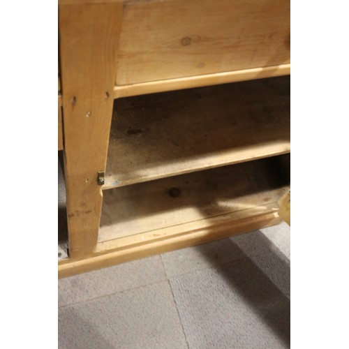 593 - A waxed pine dresser base, fitted three drawers, 