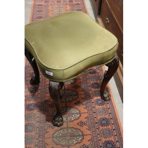 454 - A 19th century carved mahogany shape top stool, on acanthus scroll supports and lion paw feet, 20