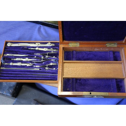 99 - A set of drawing instruments, in fitted mahogany box, another similar box, rules, two Persian white ... 