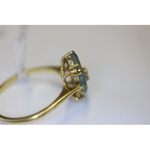 255 - An 18ct gold diamond and aquamarine dress ring, size P, 3.4g