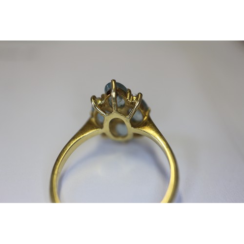 255 - An 18ct gold diamond and aquamarine dress ring, size P, 3.4g