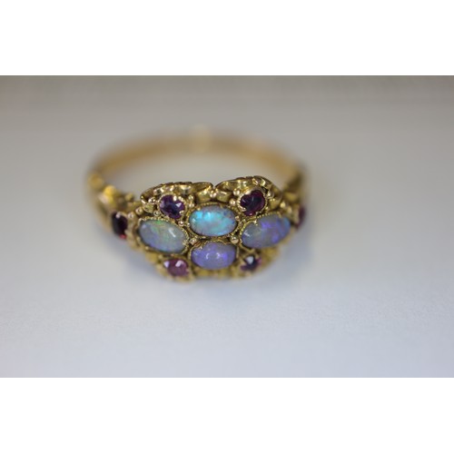 273 - A Victorian yellow metal, opal and ruby dress ring, size L, 1.9g