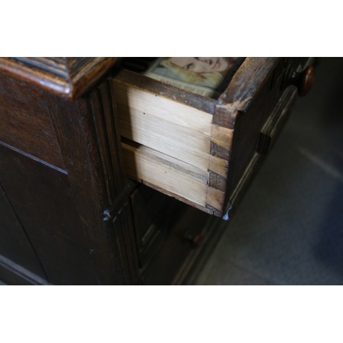 424 - An 18th century oak chest of three drawers with fielded panel fronts and knob handles, 32