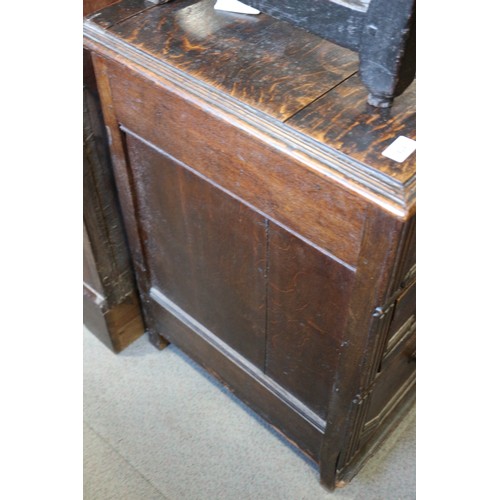 424 - An 18th century oak chest of three drawers with fielded panel fronts and knob handles, 32