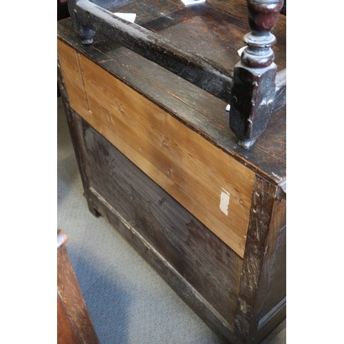 424 - An 18th century oak chest of three drawers with fielded panel fronts and knob handles, 32