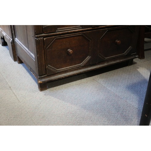 424 - An 18th century oak chest of three drawers with fielded panel fronts and knob handles, 32