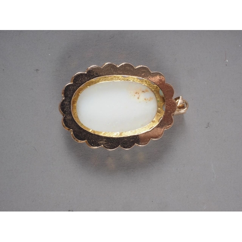 283 - A yellow metal and opal pendant