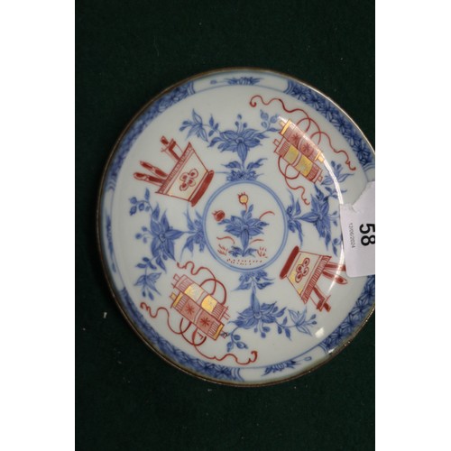 58 - A Chinese porcelain saucer dish, decorated precious objects in the Imari palette, 4 1/2