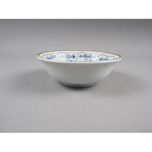 91 - An antique Chinese blue and white porcelain bowl, central circle surrounded by eight cartouches of a... 