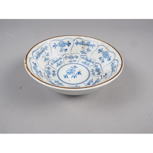 91 - An antique Chinese blue and white porcelain bowl, central circle surrounded by eight cartouches of a... 