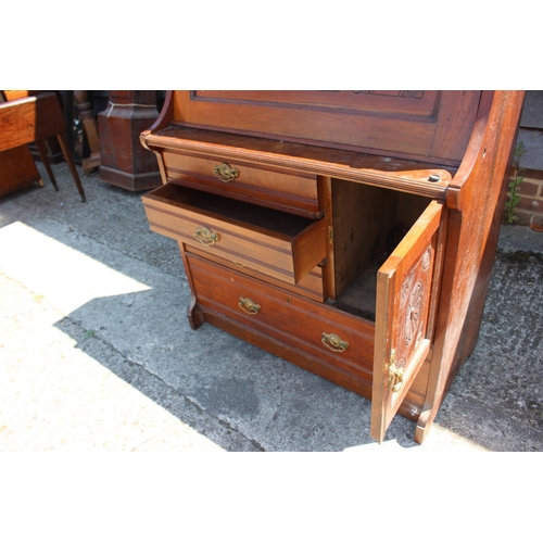 421 - A late Victorian carved walnut fall front bureau with fitted interior over cupboard, three smaller a... 