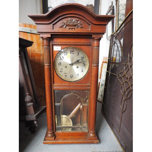 103 - A 1930s Ansonia oak cased wall clock with silvered dial, 33