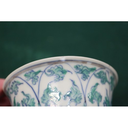 86 - A pair of Chinese teacups with floral and leaf decoration, four-character marks to bases, 3 1/4