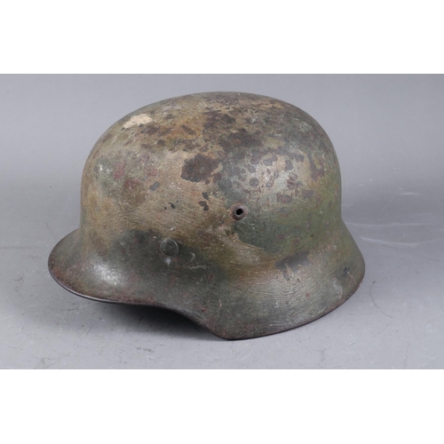 143 - A WWII German helmet with leather lining