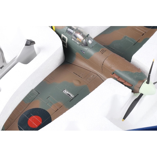 144 - Two Corgi Aviation Archive Spitfires, Mk11A P7966 - Douglas Bader and Mk1A 4590, boxed, and a compan... 