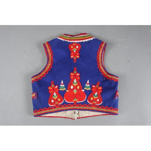 174 - A girl’s Polish embroidered waistcoat, back 14” long