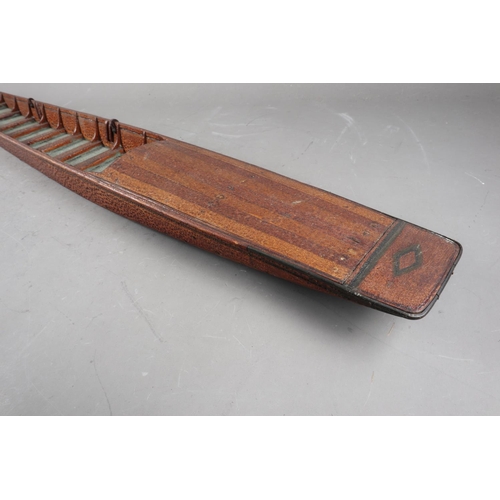 194 - An early 20th century hardwood model punt, Makers label: 