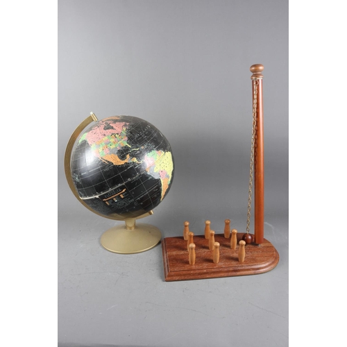 195 - A terrestrial globe, in original box, and a bar skittles set