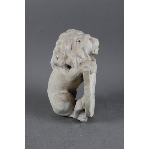 217 - A carved marble figure of a lion holding a shield, 9