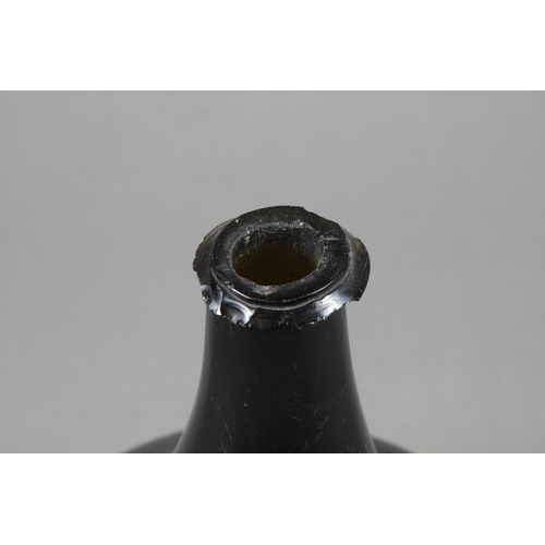 38 - An early 18th century green glass onion wine bottle, 7 1/4