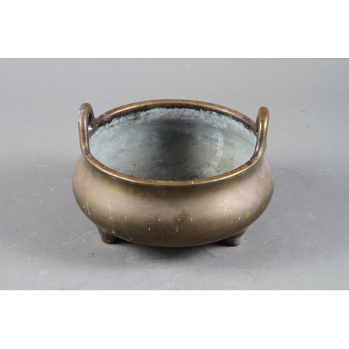 94 - A Chinese bronze censer on three legs, seal mark, 6” dia 1474g