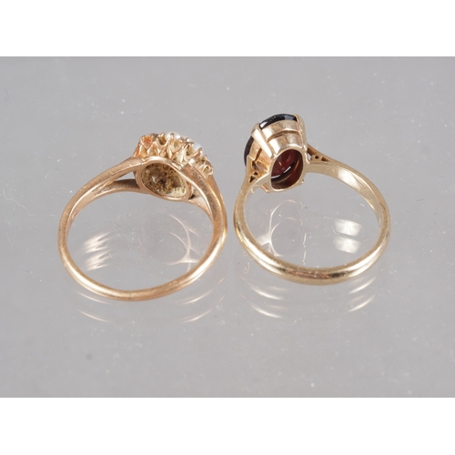 290 - A yellow metal and seed pearl cluster ring, size N/O, 2.2g, and a 9ct gold and garnet single stone r... 