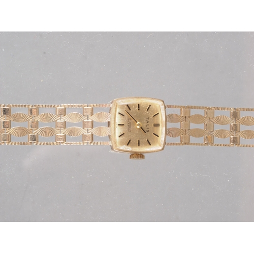 293 - A lady's 9ct gold Talis wristwatch, 19.4g gross