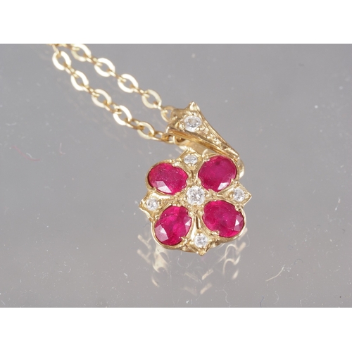 300 - A 9ct gold red and clear stone pendant with 9ct gold fine link chain, and another similar pendant Fr... 