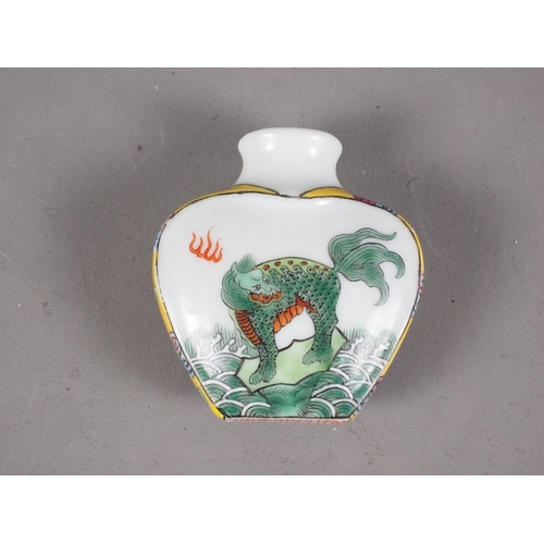 88 - A Chinese snuff bottle with mythical beast decoration and seal mark to base, 1 3/4” high