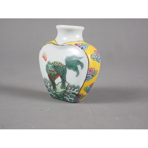 88 - A Chinese snuff bottle with mythical beast decoration and seal mark to base, 1 3/4” high