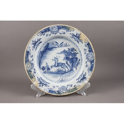 3 - An 18th century chinoiserie decorated blue and white delft charger, 13” dia, another decorated stag,... 