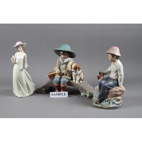 10 - A Lladro figure, “The Old Fishing Hole” 12237, 11 3/4” wide, in box, another Lladro figure of a ball... 