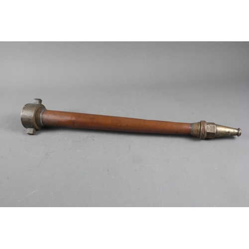 109 - A copper and brass fire hose nozzle, 23” long