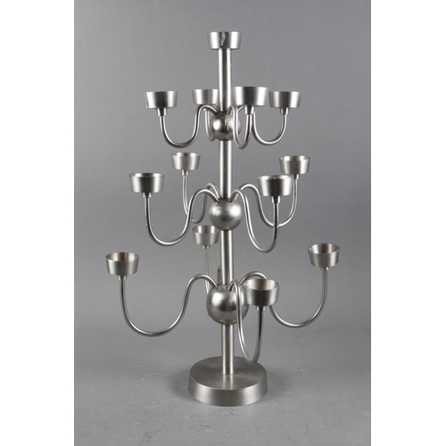 114 - A stainless steel thirteen-light table candelabra, 20” high