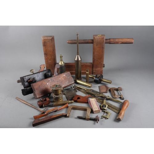 128 - A carpenter’s large wood G-clamp, two smaller metal G-clamps, a number of moulding planes and ... 