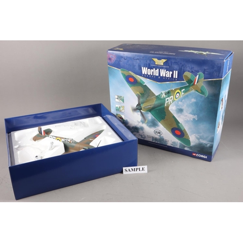 144 - Two Corgi Aviation Archive Spitfires, Mk11A P7966 - Douglas Bader and Mk1A 4590, boxed, and a compan... 