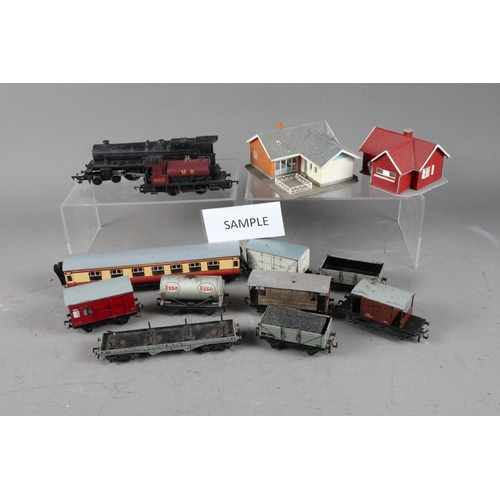 166 - A quantity of mostly tin-plate Dublo Gauge trains, including locomotives, carriages, and accessories