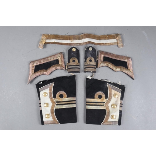 175 - A pair of Gieves early 20th century naval epaulettes, matching cuffs, pockets and collar with gilt b... 