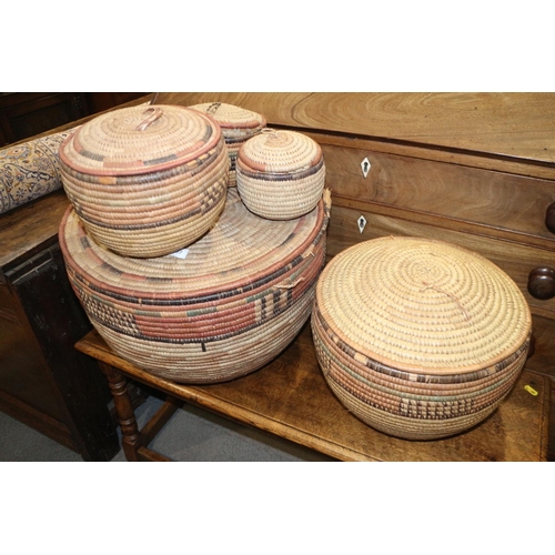 187 - A set of five 20th century West African woven rush baskets, largest 18