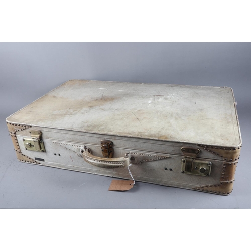 192 - An Allemand Arniaud vellum brass studded suitcase, 27 3/4” wide