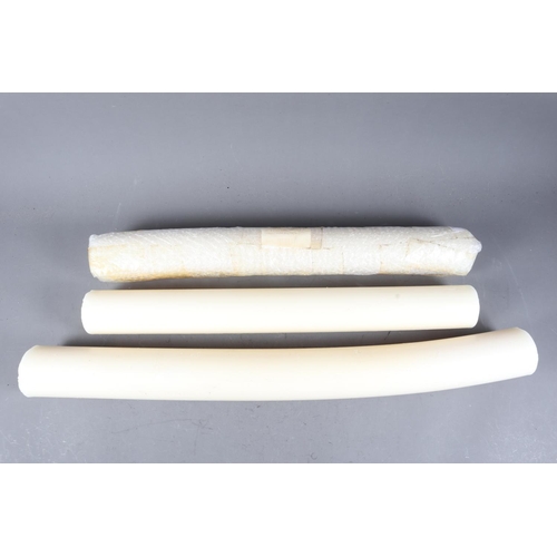 193 - Three ecclesiastical beeswax candles, largest 29 1/2” long