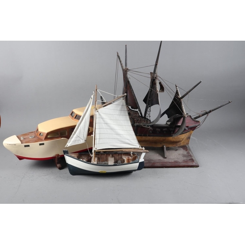 208 - A painted wooden scale model of a galleon, 17” high (damaged), a scale model of a sailing boat... 