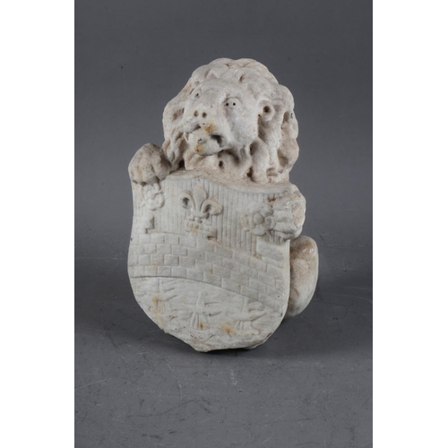 217 - A carved marble figure of a lion holding a shield, 9