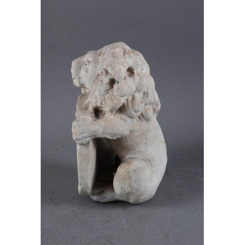 217 - A carved marble figure of a lion holding a shield, 9