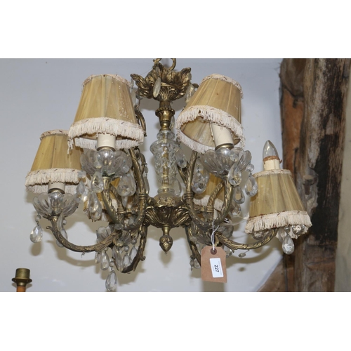 227 - A brass six-light chandelier with cut glass drops