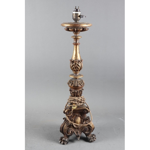 228 - A carved gilt wood candlestick, now a table lamp, 17” high, and two similar smaller candlesticks