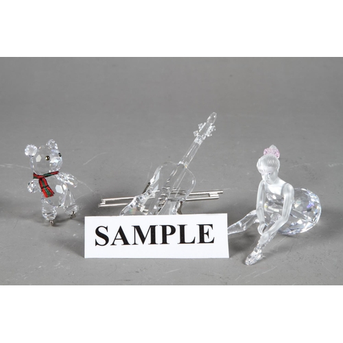 23 - A Swarovski figure of a young ballerina 254960, a model Christmas tree 266945, a model saxophone 211... 