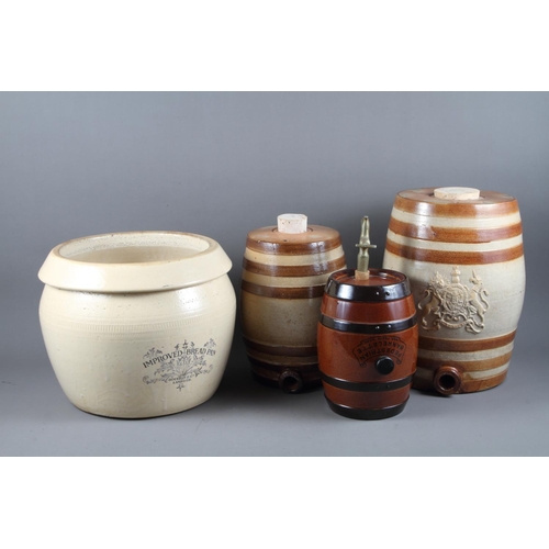 6 - A Doulton Lambeth stoneware spirit barrel, 13” high, two other similar smaller barrels and a b... 