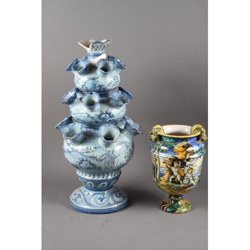 65 - A Cantagali blue and white tulip vase, 20” high, and a Cantagali majolica urn with landscape decorat... 